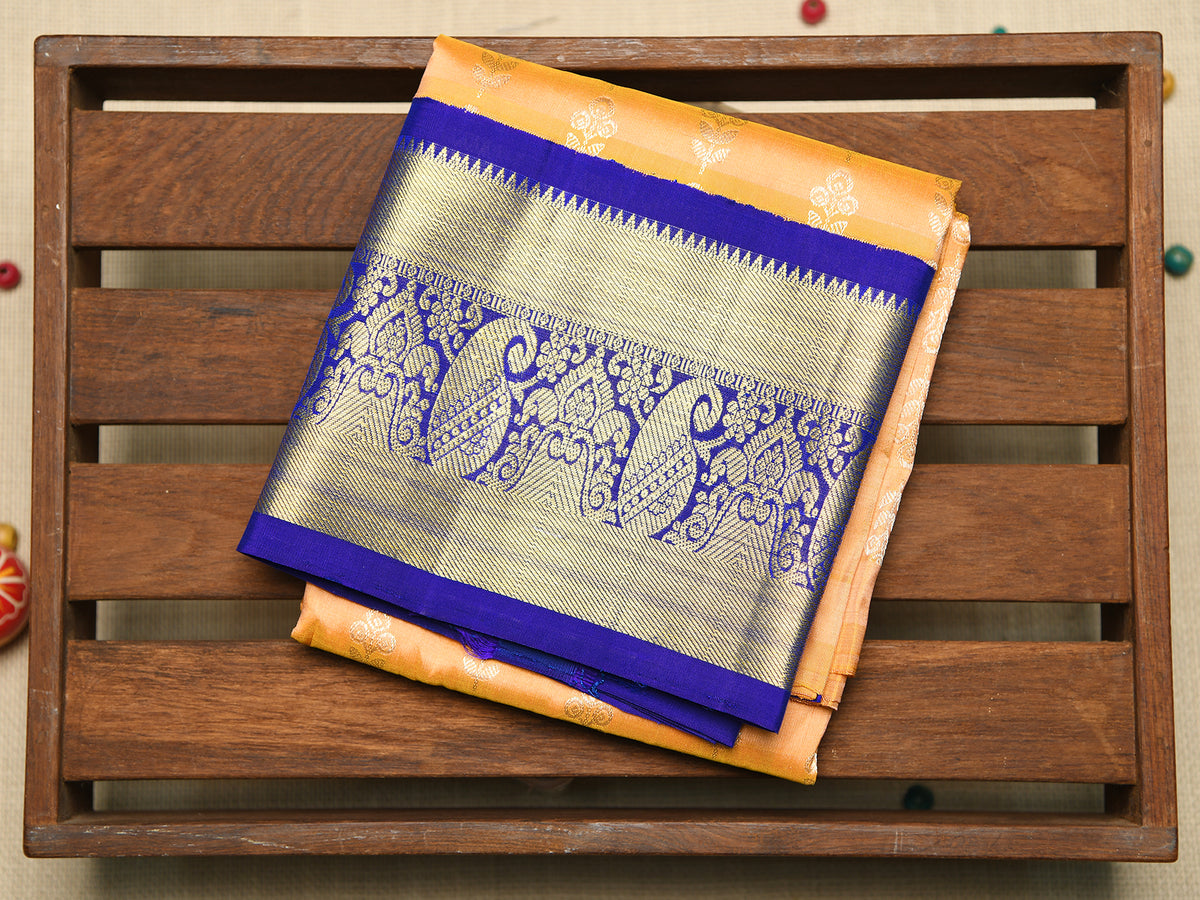Contrast Traditional Korvai Border With Floral Buttis Soft Orange Kanchipuram Silk Unstitched Pavadai Sattai Material