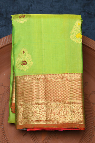 Creepers Floral Zari Border With Meenakari Work Thilagam Butta Pear Green Kanchipuram Silk Saree