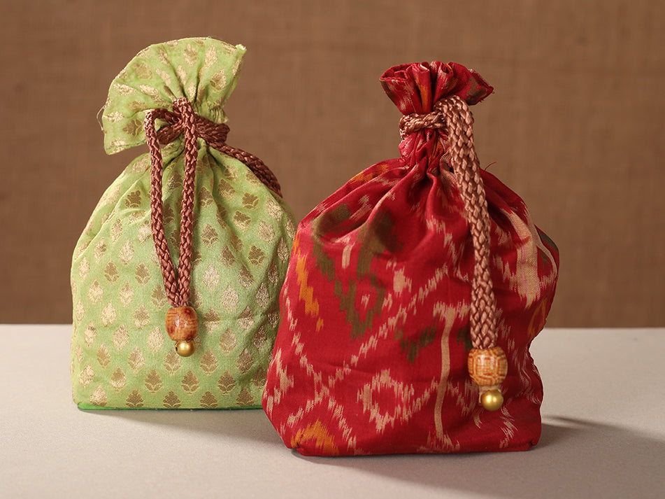 Set Of 2 Pista Green Brocade And Red Silk Ikat Potli Bags