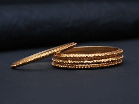 Set Of 4 Embossed Gold Plated Pure Silver Bangles