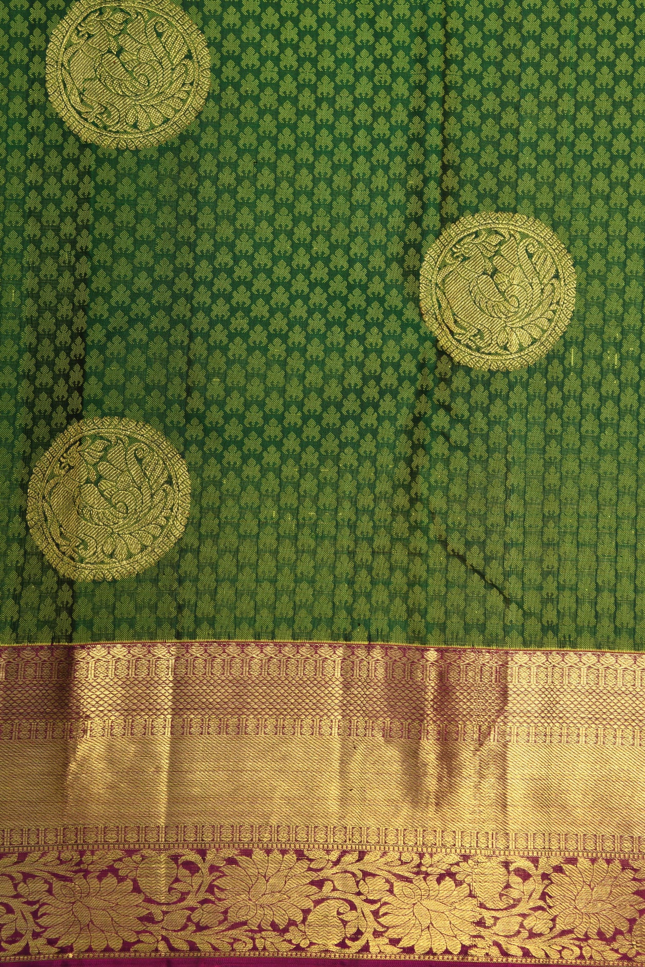 Traditional Zari Border With Peacock Butta Leaf Green Kanchipuram Silk Saree