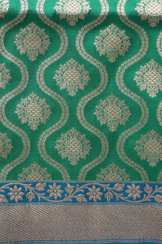Zari Border With Ogee Pattern And Floral Buttis Green Banaras Silk Saree