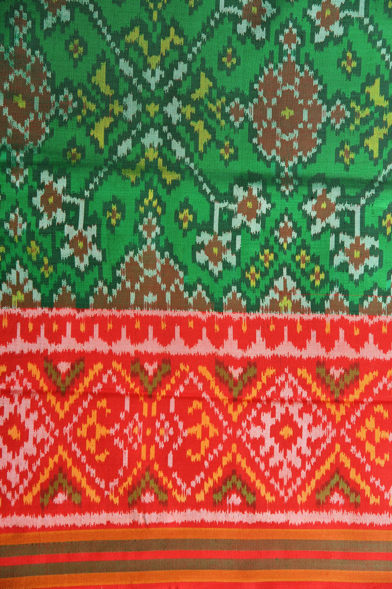 Ikat Weave Pattern Green Spun Patola Silk Saree